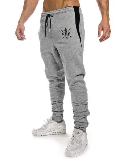 Graue Legacy Sporthose von Gym Generation für anspruchsvolle Sportler, hochwertiges Design mit Spartaner-Logo und silbernen Schnürbändern.